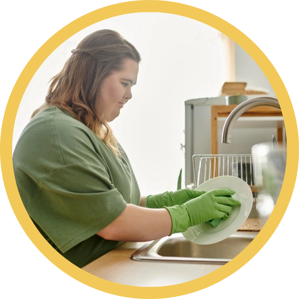 women with down syndrome disability washing dishes