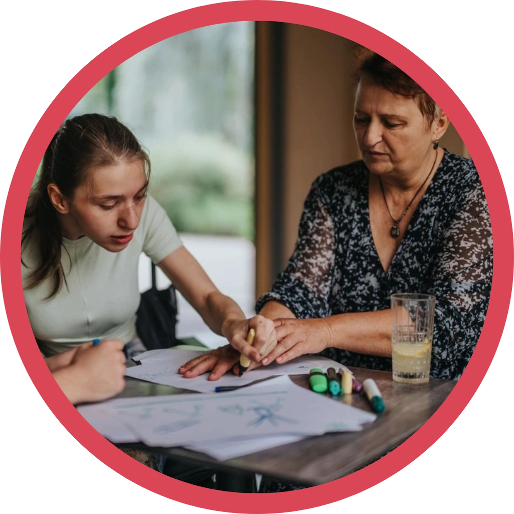 women tutoring disabled students