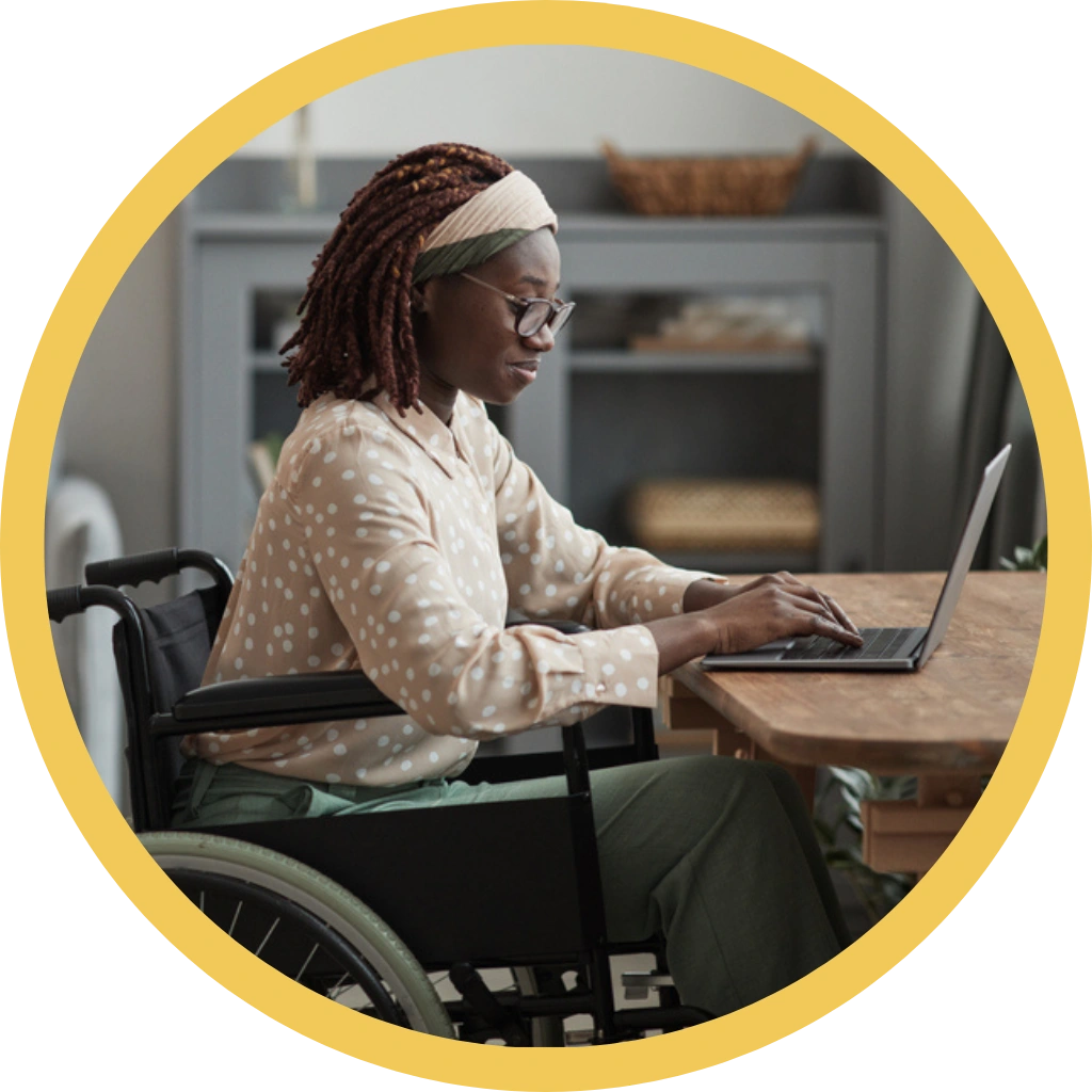 disabled women on wheelchair looking at laptop